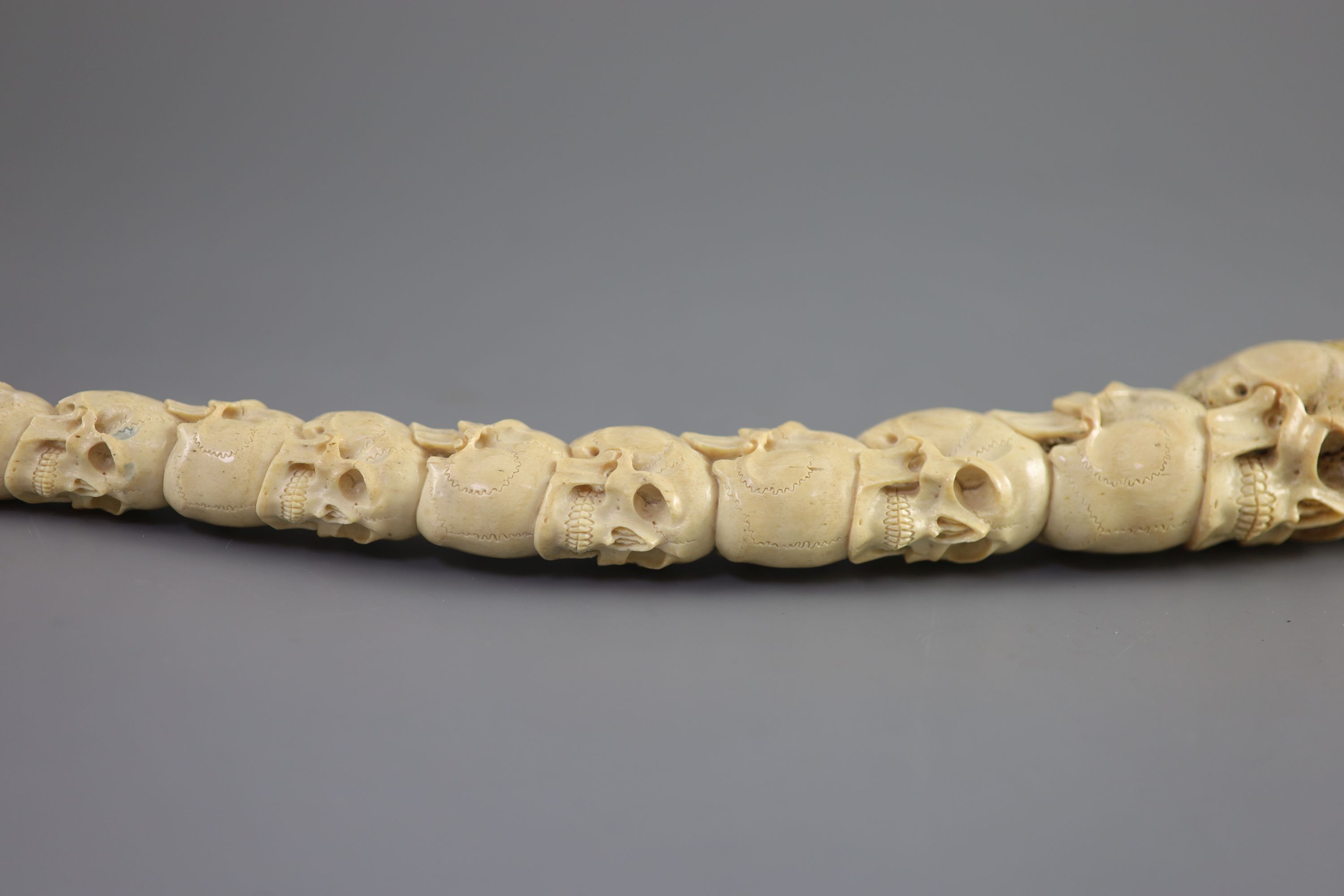 A unusual Inuit ‘skull’ carved walrus baculum, believed to be 19th century, 49.5 cm long